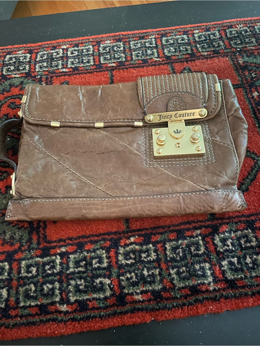 Juicy Couture “Bacardi” distressed leather clutch